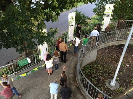 Group of people walking up ramp